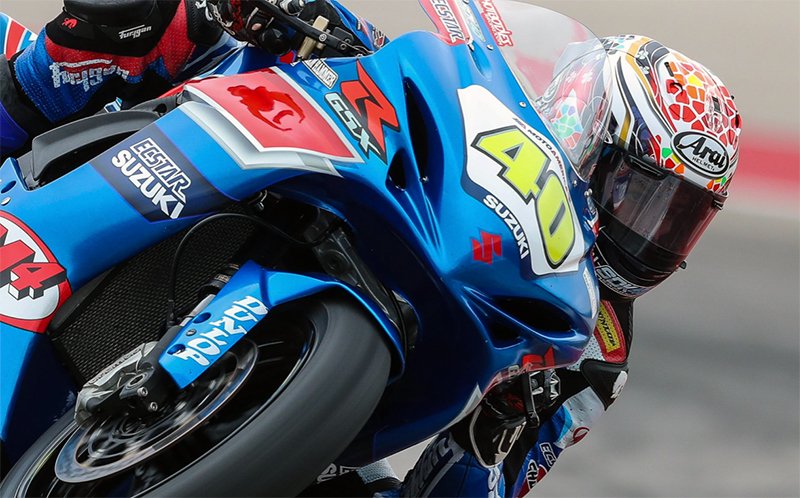 Motorcycle racer wearing Arai helmet